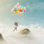 Little girl flying away with a bunch of balloons