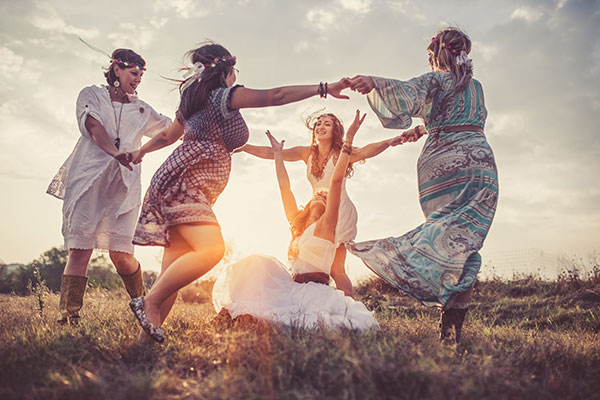 Group of girlfriends dancing in a circle